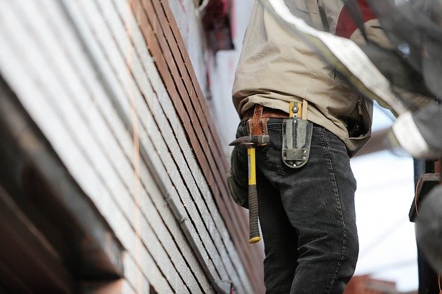 Problem Solved Home Improvements roofing crew member at work